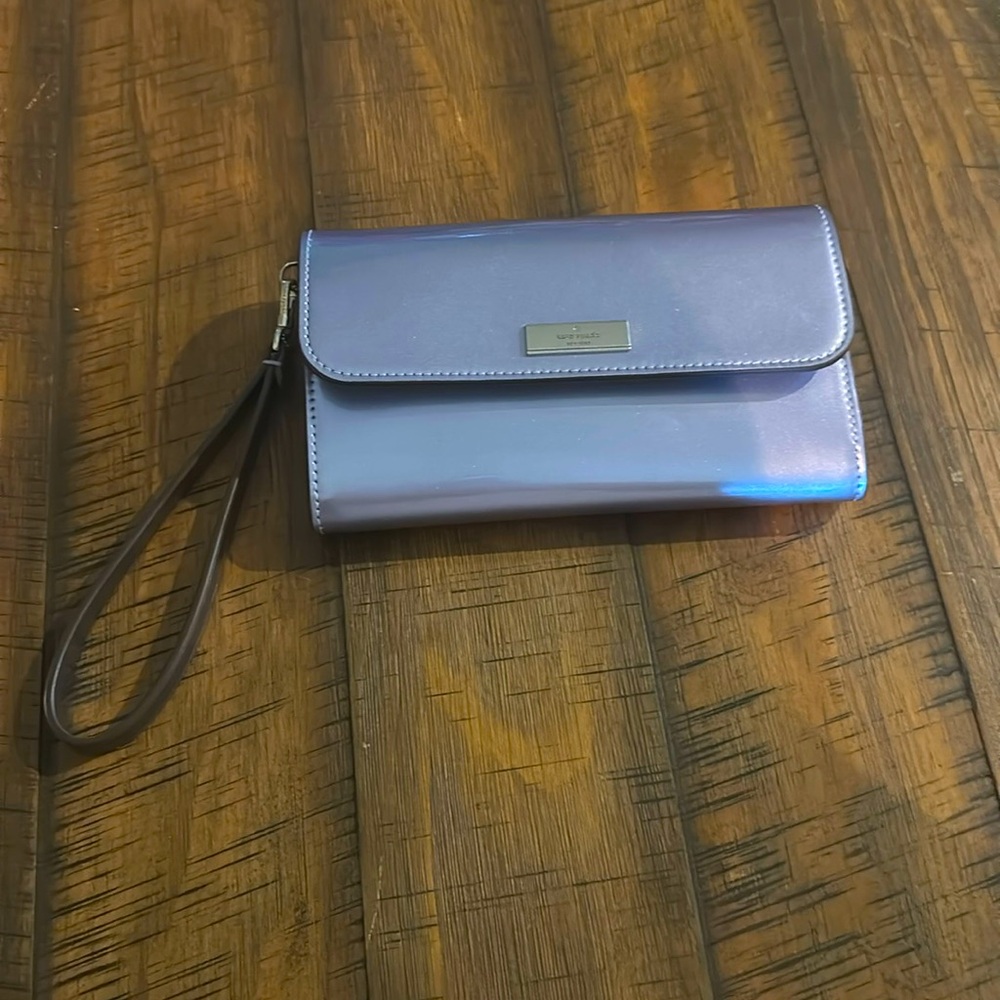 This is a Kate Spade Kenzie blue grey metallic wristlet